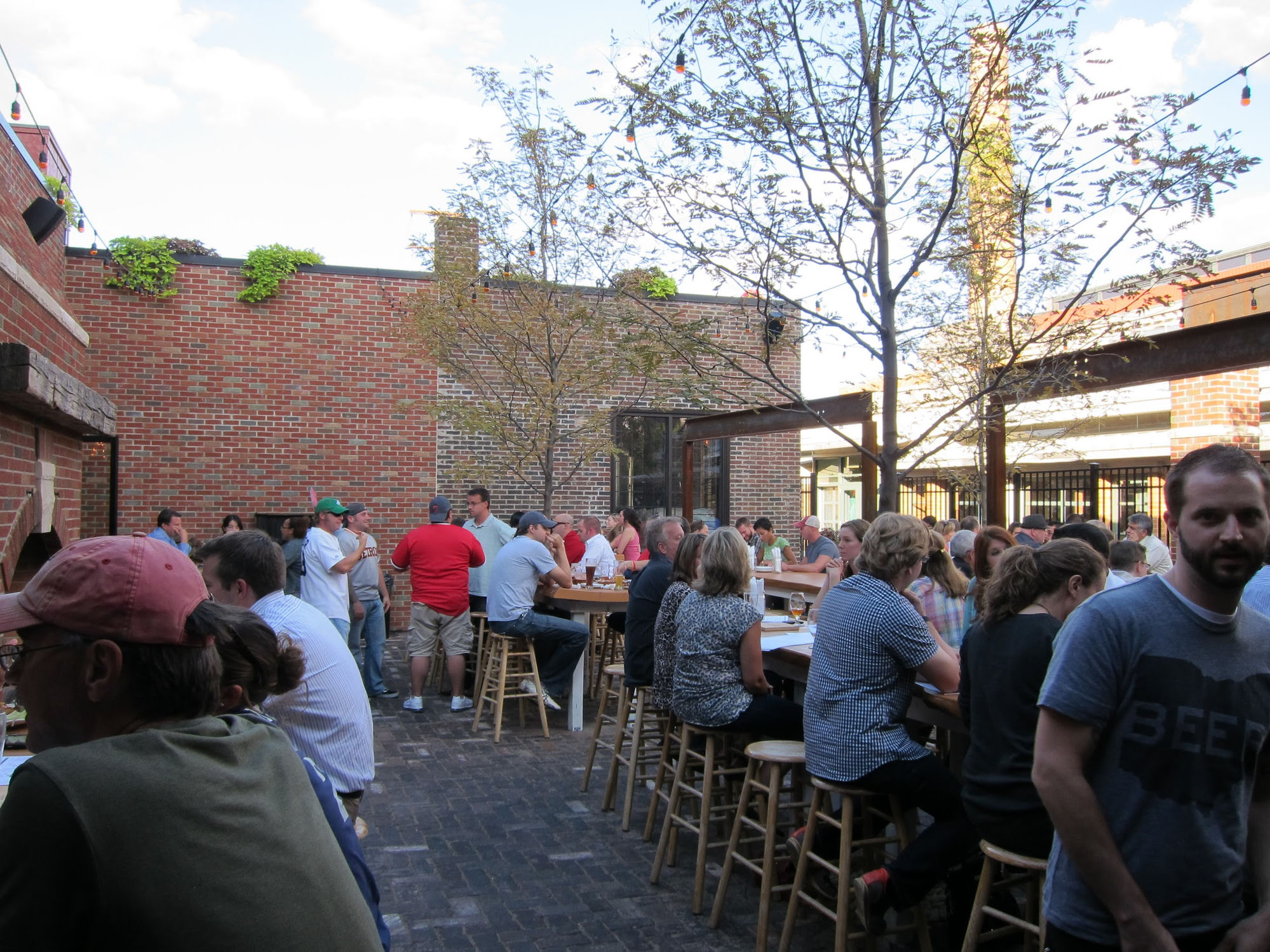 Market Garden Brewery beer garden packed with patrons on a summer evening