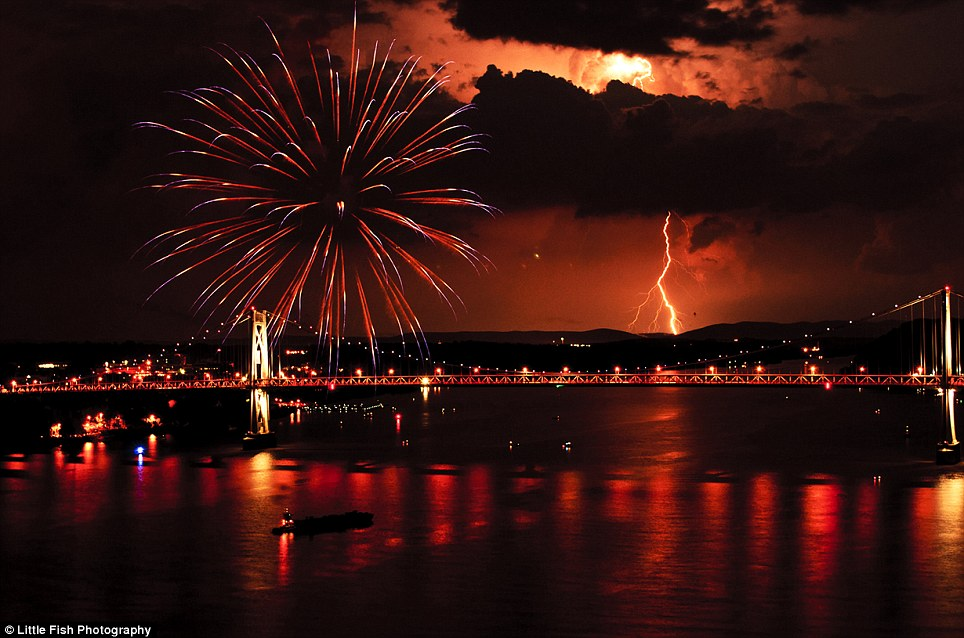 Fireworks and lightning simultaneously over the Mid-Hudson Bridge and Hudson River, viewed from the Walkway over the Hudson. Photo by Mike Pescetti / Little Fish Photography.